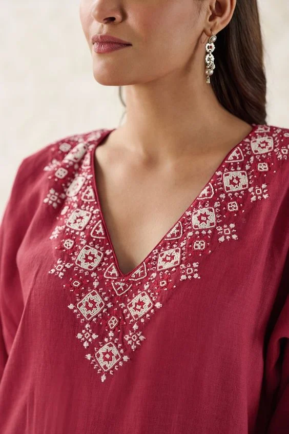 Scalloped Edges on Scoop Suit Neck