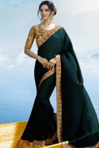 Green saree with a beige blouse